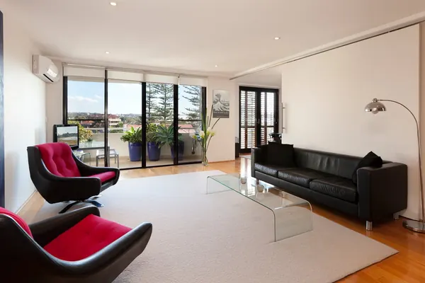 Bright open-plan living room with balcony doors